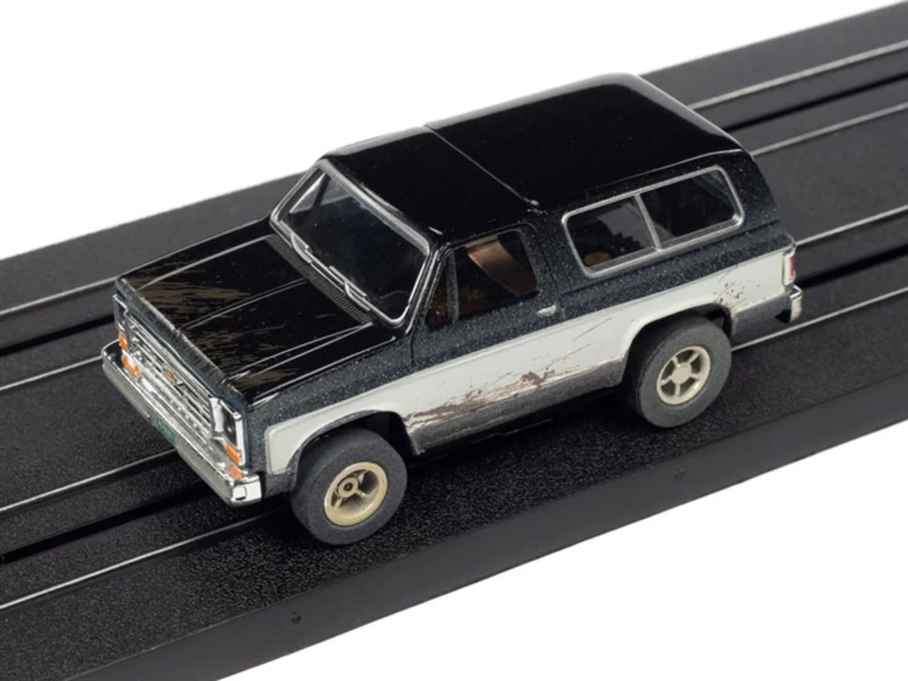 Auto World 1977 Chevrolet Blazer (Black/White) X-Traction R1 HO Slot Car - Image 2